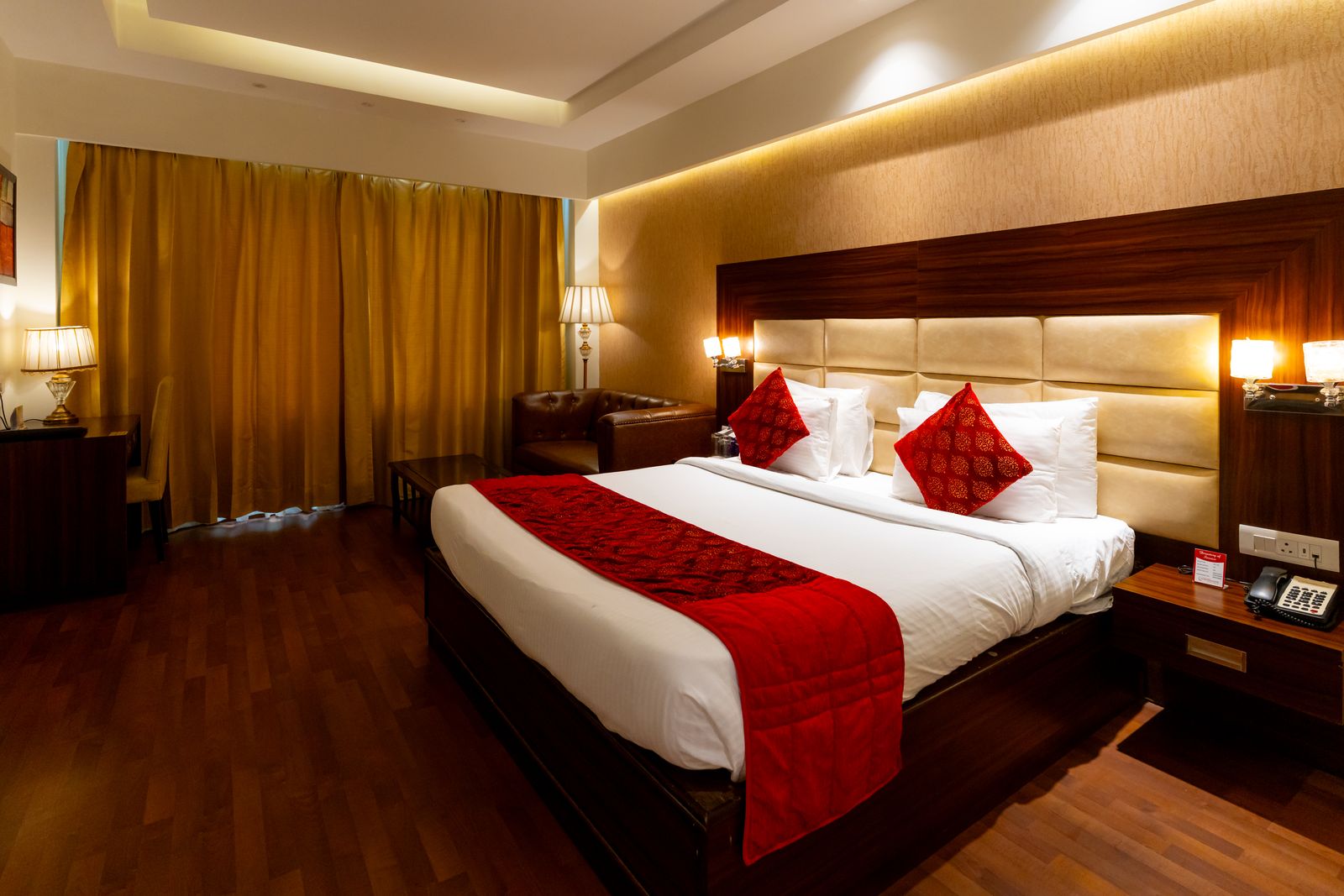 Executive Room: The bed under its padded headboard