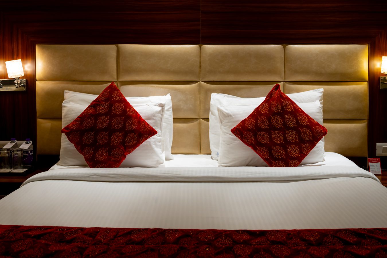 An Executive Room, the king bed under its padded headboard