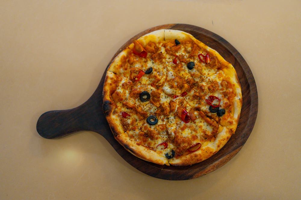 A pizza on the board at Galaxy