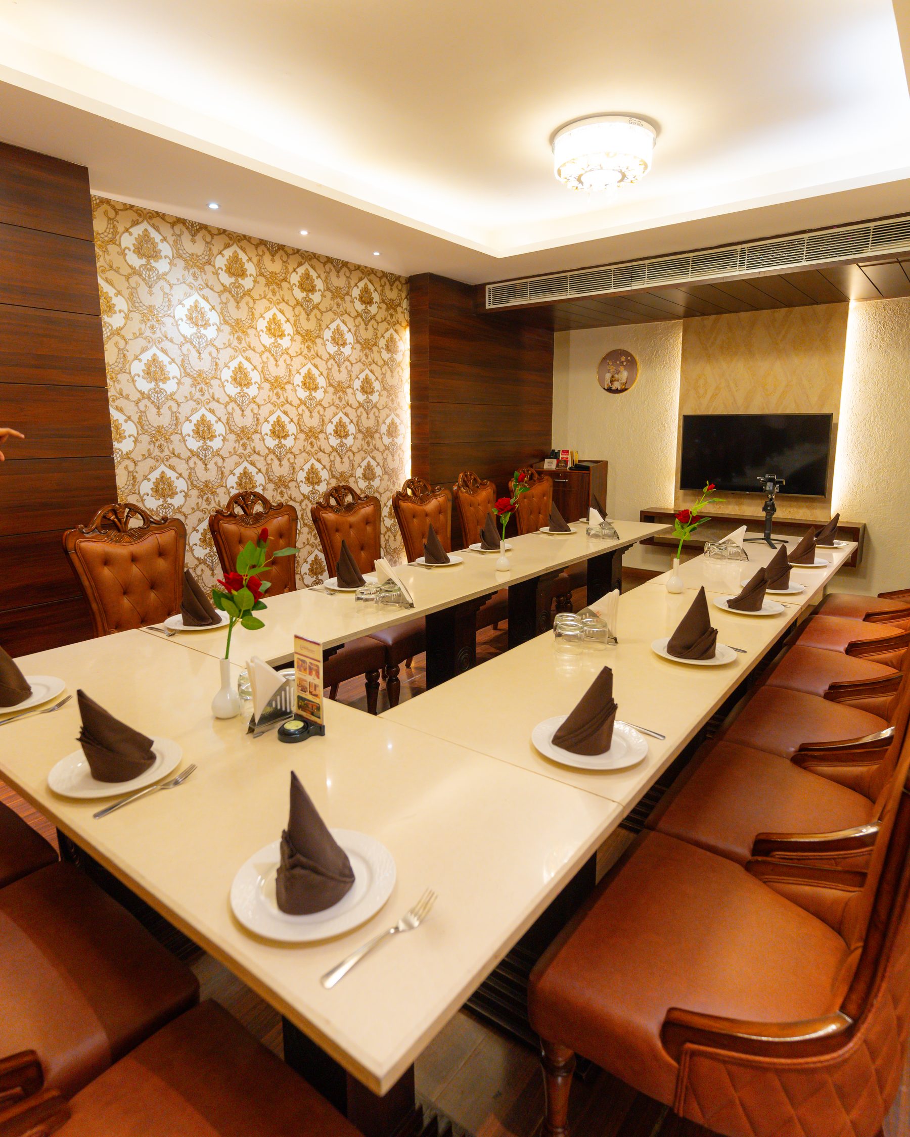 A private dining room, the tables laid in a U