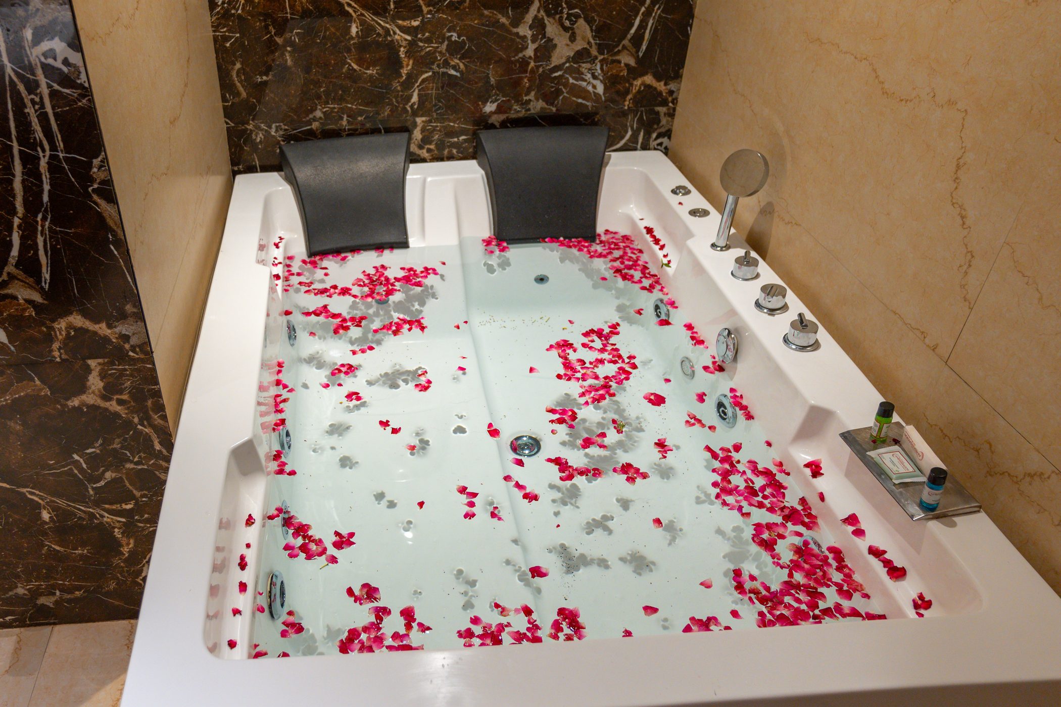 Suite: The bath, a corner tub drawn with petals