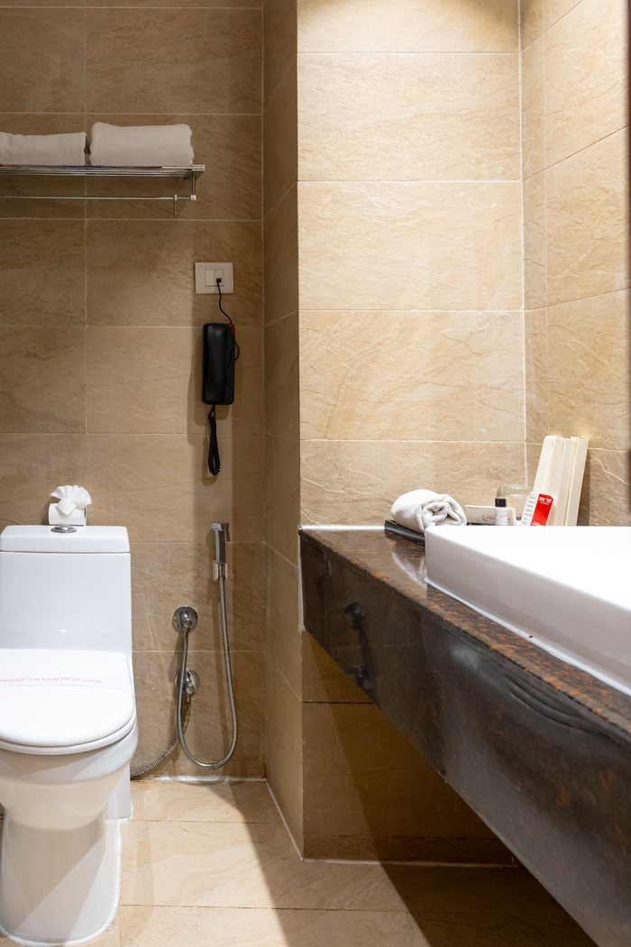 The twin room's bathroom, the long vanity in dark marble